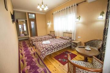 Фото номера Двухместный номер с 2 отдельными кроватями Гостевой дом Eco House г. Ош 18