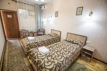 Фото номера Двухместный номер с 2 отдельными кроватями Гостевой дом Eco House г. Ош 15
