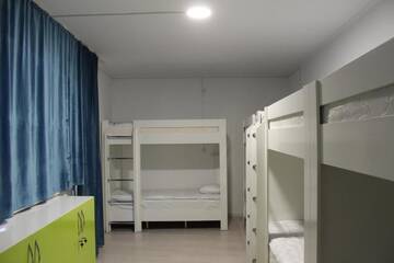Фото номера Спальное место на двухъярусной кровати в общем номере для женщин Хостелы Park Hostel Osh г. Ош 7